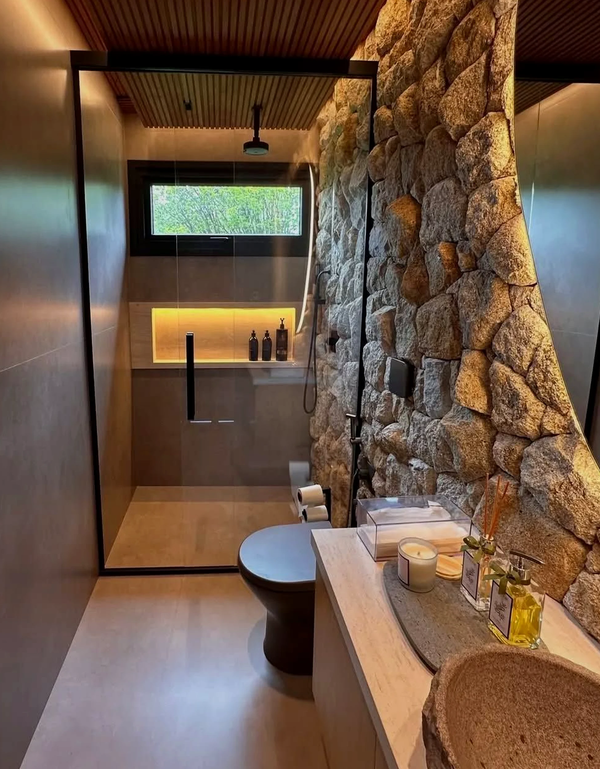 Calm stone terrace introduces softness into the composition, keeping the atmosphere quietly finished.